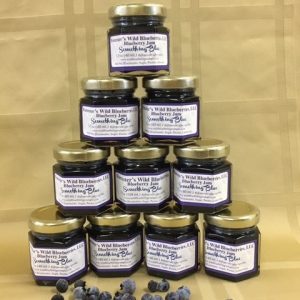 Triangle tower of small favor sized blueberry jams