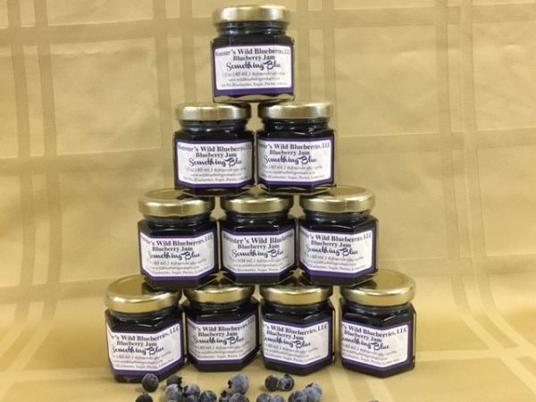 Triangle tower of small favor sized blueberry jams